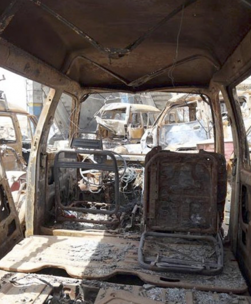 Burned-out cars lined up by the Jarman petrol station, Saada City, Yemen, which was struck in an aerial attack on April 15, 2015. © 2015 Ole Solvang/Human Rights Watch