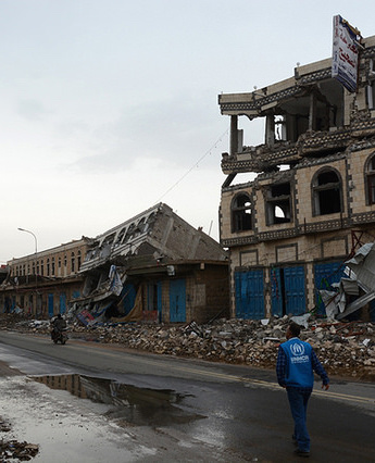 UNHCR staff in Saada, Yemen, on a road of shops hit by airstrikes, 2015 (https://flic.kr/p/BwWwjw)